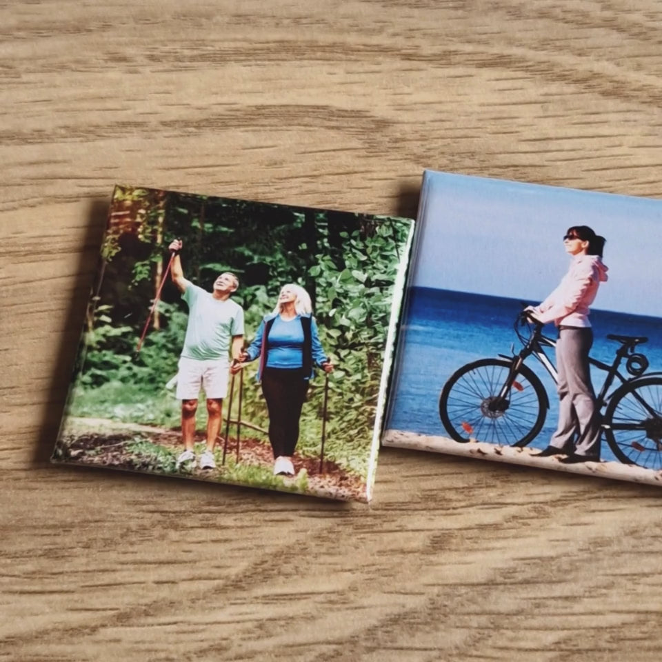 A video panning through a row of neatly lined-up magnets, each featuring a unique design. The camera smoothly moves from left to right, showcasing the variety of images on the magnets