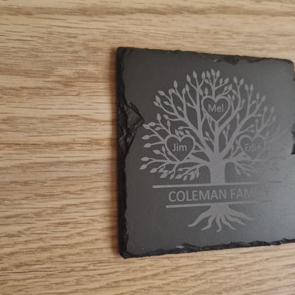 Close-up view of an engraved family tree design on a slate coaster, showcasing intricate details and customisation options for a personalised gift.